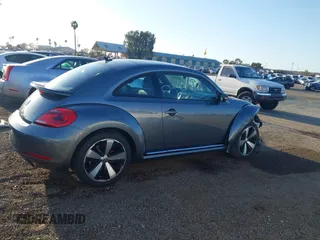 2012 Volkswagen Beetle 2.0T Turbo w/Sun/Snd/Nav PZEV with VIN 3VWVA7AT4CM628968, listed as a IAAI auction lot 41847614 with 71,813 mi miles. Bid and sale history available at carsss.com. Image 14.