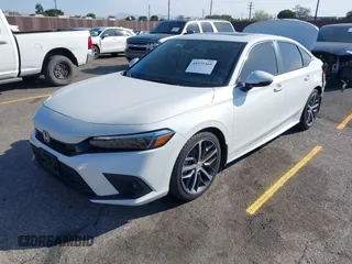 2024 Honda Civic Touring z VIN 2HGFE1F93RH303145, wystawiony jako IAAI lot #41975369 z przebiegiem 32 644 mil mil oraz . Historia ofert i sprzedaży dostępna na DreamBid. Obrazek 17.