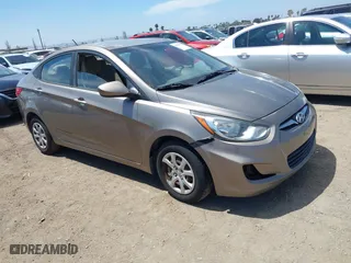 2012 Hyundai Accent GLS with VIN KMHCT4AEXCU261411, listed as a IAAI auction lot 42087696 with 122,184 mi miles. Bid and sale history available at carsss.com. Image 1.