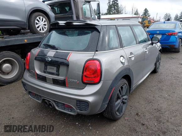 2017 MINI Hardtop 4 Door Cooper S z VIN WMWXU3C58H2D33073, wystawiony jako IAAI lot #41913081 z przebiegiem 51 631 mil mil oraz . Historia ofert i sprzedaży dostępna na DreamBid. Obrazek 4.