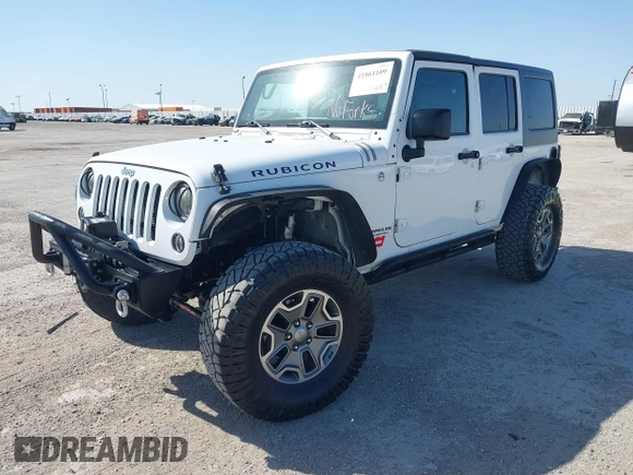 2014 Jeep Wrangler Unlimited Rubicon with VIN 1C4BJWFG1EL167423, listed as a IAAI auction lot 41861109 with 104,669 mi miles. Bid and sale history available at carsss.com. Image 2.