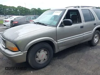 1999 GMC Jimmy SLE z VIN 1GKCS13W0X2512048, wystawiony jako IAAI lot #42364175 z przebiegiem 195 301 mil mil oraz . Historia ofert i sprzedaży dostępna na DreamBid. Obrazek 6.