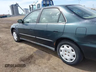 1999 Honda Accord LX with VIN 1HGCG6654XA145126, listed as a IAAI auction lot 42090873 with 76,421 mi miles and . Bid and sale history available at DreamBid. Image 14.