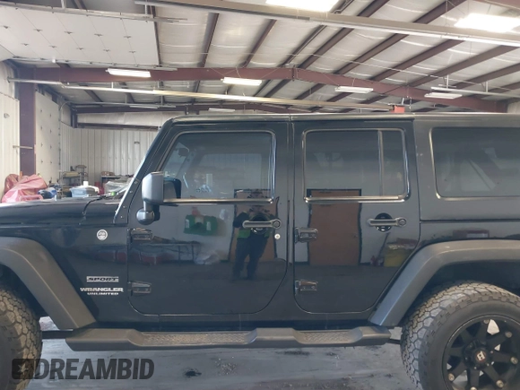 2012 Jeep Wrangler Unlimited Sport with VIN 1C4BJWDG8CL246829, listed as a IAAI auction lot 41816197 with 198,502 mi miles. Bid and sale history available at carsss.com. Image 15.