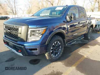2021 Nissan Titan Pro-4X z VIN 1N6AA1ED1MN517476, wystawiony jako IAAI lot #41422217 z przebiegiem 62 650 mil mil oraz . Historia ofert i sprzedaży dostępna na DreamBid. Obrazek 2.
