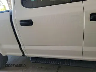 2020 Ford F-150 XL with VIN 1FTFW1E5XLKF11517, listed as a IAAI auction lot 42303677 with 128,253 mi miles and . Bid and sale history available at DreamBid. Image 1.