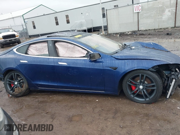 2016 Tesla Model S 90D with VIN 5YJSA1E44GF169960, listed as a IAAI auction lot 41523807 with 124,738 mi miles and . Bid and sale history available at DreamBid. Image 13.