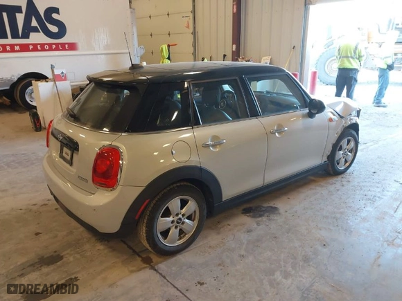 2018 MINI Hardtop 4 Door Cooper with VIN WMWXU1C50J2F79271, listed as a IAAI auction lot 41298686 with 75773 miles. Bid and sale history available at carsss.com. Image 4.