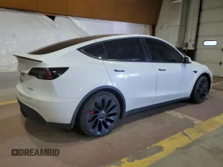 2022 Tesla Model Y Performance with VIN 7SAYGDEF7NF520825, listed as a Copart auction lot 57400245 with 55,437 mi miles and Salvage title. Bid and sale history available at DreamBid. Image 3.