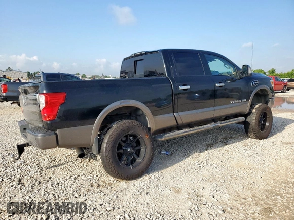 2017 Nissan Titan Platinum Reserve with VIN 1N6BA1F43HN568650, listed as a Copart auction lot 59593525 with 126,193 mi miles and Salvage title. Bid and sale history available at DreamBid. Image 3.