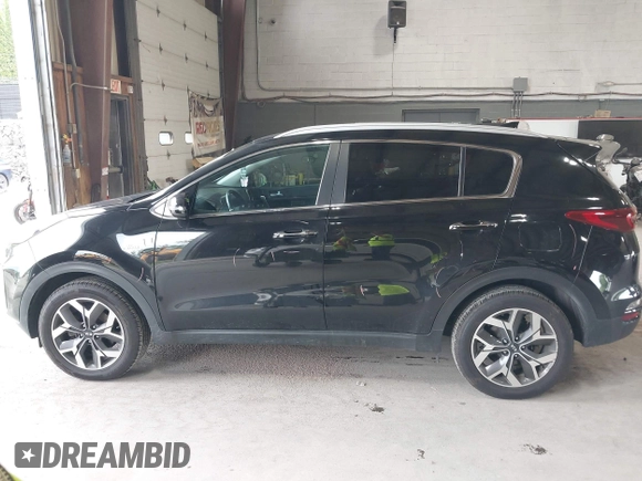 2021 Kia Sportage EX z VIN KNDPNCAC5M7886551, wystawiony jako IAAI lot #42645206 z przebiegiem 49 312 mil mil oraz . Historia ofert i sprzedaży dostępna na DreamBid. Obrazek 14.