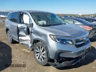 2022 Honda Pilot EX-L with VIN 5FNYF6H54NB018613, listed as a IAAI auction lot 41566973 with 56,173 mi miles. Bid and sale history available at carsss.com. Image 1.