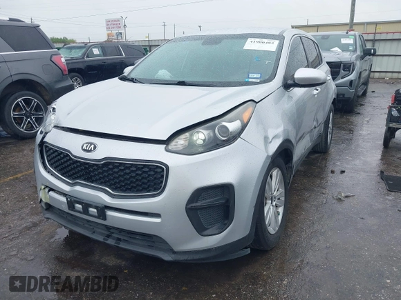 2018 Kia Sportage LX with VIN KNDPM3AC7J7337951, listed as a IAAI auction lot 41900482 with 105,857 mi miles and . Bid and sale history available at carsss.com. Image 2.