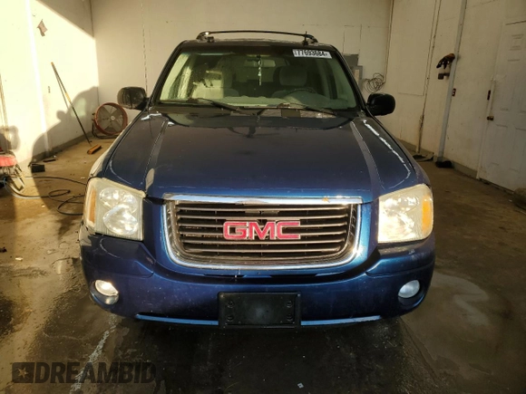 2005 GMC Envoy SLT with VIN 1GKDS13S652339845, listed as a Copart auction lot 77693684 with 220,306 mi miles and Salvage Title. Bid and sale history available at carsss.com. Image 5.