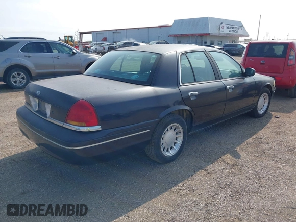 2000 Ford Crown Victoria LX z VIN 2FAFP74W4YX188831, wystawiony jako IAAI lot #41221337 z przebiegiem 169 380 mil mil oraz . Historia ofert i sprzedaży dostępna na DreamBid. Obrazek 4.