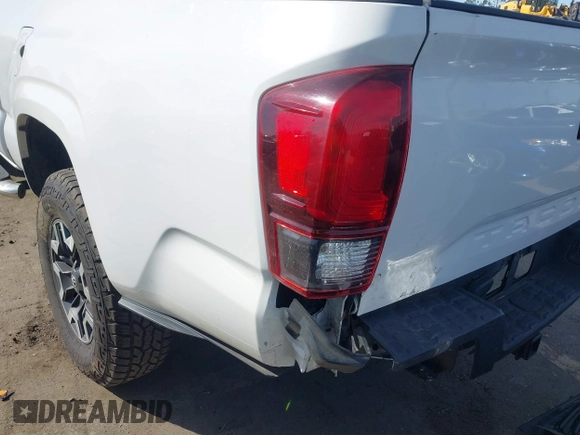 2018 Toyota Tacoma SR with VIN 5TFRX5GN9JX106232, listed as a IAAI auction lot 41634120 with 66,674 mi miles and . Bid and sale history available at DreamBid. Image 6.
