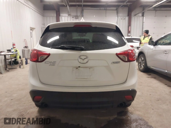 2014 Mazda CX-5 Grand Touring with VIN JM3KE4DY3E0374036, listed as a IAAI auction lot 41889030 with 162,611 mi miles and . Bid and sale history available at DreamBid. Image 16.