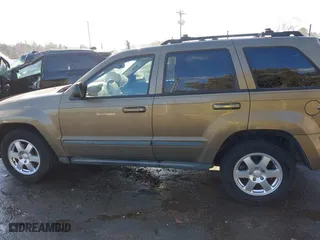 2009 Jeep Grand Cherokee Laredo with VIN 1J8GS48K79C516320, listed as a IAAI auction lot 41353131 with 166,739 mi miles. Bid and sale history available at carsss.com. Image 14.