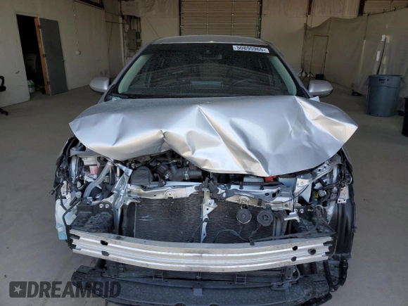 2021 Toyota Corolla Hybrid LE with VIN JTDEAMDE4MJ018825, listed as a Copart auction lot 50895965 with 93,988 mi miles and Salvage Title. Bid and sale history available at carsss.com. Image 5.