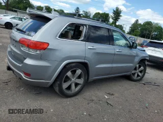 2015 Jeep Grand Cherokee Overland with VIN 1C4RJFCG3FC880084, listed as a Copart auction lot 57291165 with 112,442 mi miles and Salvage title. Bid and sale history available at DreamBid. Image 3.
