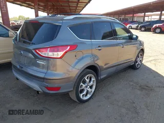 2013 Ford Escape Titanium with VIN 1FMCU0J95DUA29390, listed as a IAAI auction lot 42720269 with 147,413 mi miles and . Bid and sale history available at DreamBid. Image 4.