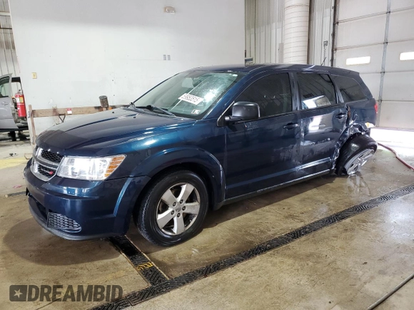 2013 Dodge Journey American Value with VIN 3C4PDCAB4DT581984, listed as a Copart auction lot 59953515 with 166,927 mi miles and Salvage title. Bid and sale history available at DreamBid. Image 1.