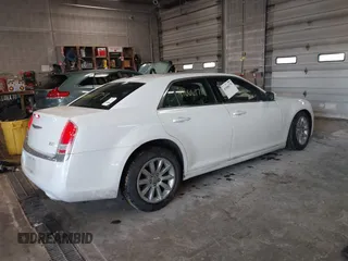 2014 Chrysler 300 with VIN 2C3CCAAGXEH217715, listed as a IAAI auction lot 41666179 with 145,744 mi miles and . Bid and sale history available at DreamBid. Image 4.