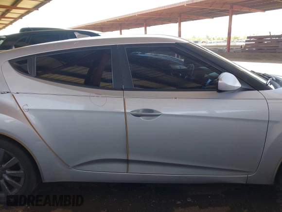 2012 Hyundai Veloster w/Black Int z VIN KMHTC6AD2CU052067, wystawiony jako IAAI lot #42261316 z przebiegiem 187 234 mil mil oraz . Historia ofert i sprzedaży dostępna na DreamBid. Obrazek 13.