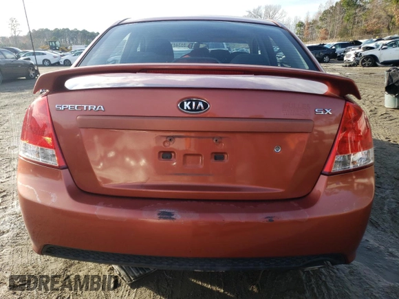 2009 Kia Spectra SX with VIN KNAFE221X95026213, listed as a Copart auction lot 85348104 with 124,171 mi miles and Salvage Title. Bid and sale history available at carsss.com. Image 6.
