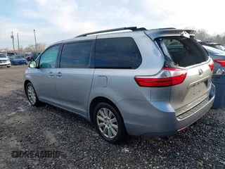 2017 Toyota Sienna LE with VIN 5TDJZ3DC6HS184126, listed as a IAAI auction lot 41166135 with 101,305 mi miles. Bid and sale history available at carsss.com. Image 3.