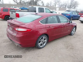 2016 Ford Fusion Titanium Hybrid with VIN 3FA6P0RU3GR355398, listed as a IAAI auction lot 41140669 with 125,959 mi miles. Bid and sale history available at carsss.com. Image 4.