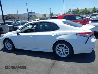 2019 Toyota Camry LE z VIN 4T1B11HK6KU754349, wystawiony jako IAAI lot #42262271 z przebiegiem 77 312 mil mil oraz . Historia ofert i sprzedaży dostępna na DreamBid. Obrazek 14.