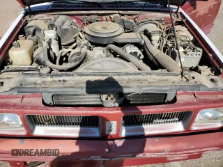 1991 Oldsmobile Bravada z VIN 1GHDT13Z0M2705443, wystawiony jako Copart lot #77072004 z przebiegiem Nie podano mil oraz Tytuł czysty. Historia ofert i sprzedaży dostępna na DreamBid. Obrazek 12.
