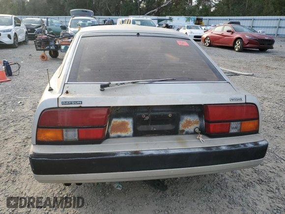 1984 Nissan 300ZX z VIN JN1HZ16S5EX016042, wystawiony jako Copart lot #86071904 z przebiegiem Nie podano mil oraz Szkoda całkowita • Salvage title. Historia ofert i sprzedaży dostępna na DreamBid. Obrazek 6.