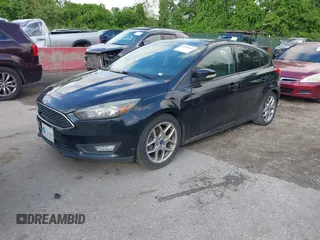 2015 Ford Focus SE with VIN 1FADP3K2XFL319559, listed as a IAAI auction lot 42205107 with 184,499 mi miles. Bid and sale history available at carsss.com. Image 2.