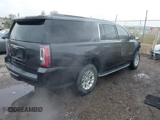 2015 GMC Yukon XL SLT with VIN 1GKS1HKC8FR219289, listed as a IAAI auction lot 40772496 with 163,477 mi miles. Bid and sale history available at carsss.com. Image 4.