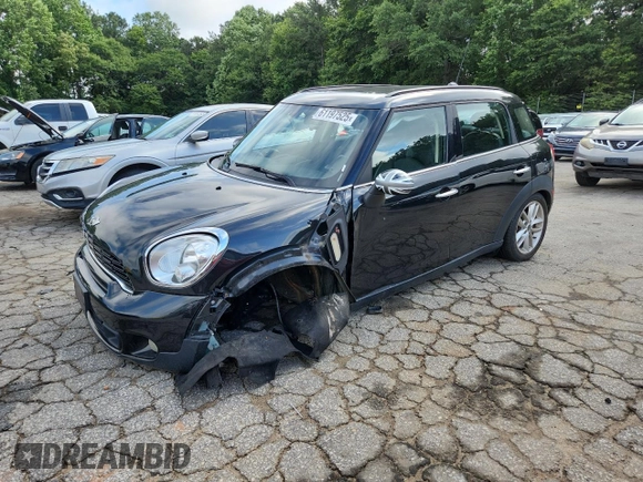 2014 MINI Countryman S with VIN WMWZC3C56EWP25479, listed as a Copart auction lot 61197525 with 101,146 mi miles and Salvage title. Bid and sale history available at DreamBid. Image 1.
