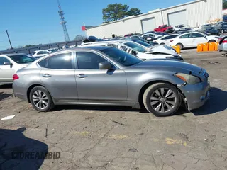 2012 Infiniti M with VIN JN1BY1AP3CM331819, listed as a IAAI auction lot 41773311 with 321,644 mi miles and . Bid and sale history available at DreamBid. Image 13.