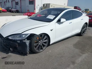 2014 Tesla Model S 60 with VIN 5YJSA1H15EFP46980, listed as a IAAI auction lot 41583672 with 61,080 mi miles and . Bid and sale history available at DreamBid. Image 2.