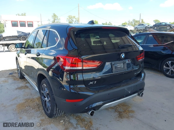 2021 BMW X1 sDrive28i with VIN WBXJG7C02M5S59010, listed as a IAAI auction lot 41933532 with 49,207 mi miles. Bid and sale history available at carsss.com. Image 3.