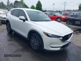 2018 Mazda CX-5 Touring with VIN JM3KFBCMXJ0366008, listed as a IAAI auction lot 42079989 with 153,868 mi miles and . Bid and sale history available at DreamBid. Image 1.