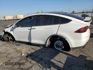 2021 Tesla Model X Long Range Plus with VIN 5YJXCBE22MF311576, listed as a Copart auction lot 68583984 with 83,137 mi miles and Salvage Title. Bid and sale history available at carsss.com. Image 2.