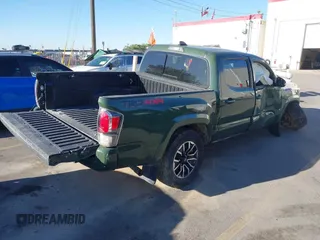 2021 Toyota Tacoma SR with VIN 3TYCZ5AN2MT039450, listed as a IAAI auction lot 40457613 with 54,176 mi miles and . Bid and sale history available at DreamBid. Image 4.
