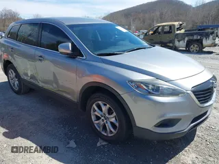 2015 Mazda CX-9 Sport with VIN JM3TB2BA7F0450544, listed as a IAAI auction lot 41812565 with 81,727 mi miles and . Bid and sale history available at carsss.com. Image 1.