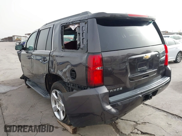 2015 Chevrolet Tahoe LT with VIN 1GNSCBKC5FR504459, listed as a IAAI auction lot 41689405 with 141,783 mi miles and . Bid and sale history available at DreamBid. Image 3.