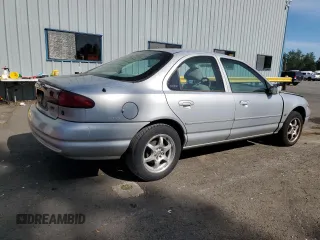 1998 Ford Contour LX with VIN 1FAFP66L2WK290948, listed as a Copart auction lot 56204295 with 76,307 mi miles and Salvage title. Bid and sale history available at DreamBid. Image 3.
