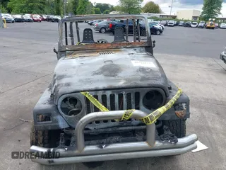 2000 Jeep Wrangler Sport with VIN 1J4FA49S5YP797345, listed as a IAAI auction lot 40322775 with Not Provided miles and . Bid and sale history available at DreamBid. Image 11.