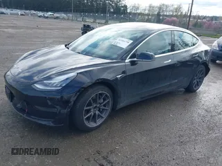 2019 Tesla Model 3 Mid Range with VIN 5YJ3E1EA4KF305611, listed as a IAAI auction lot 41916738 with 59,101 mi miles and . Bid and sale history available at carsss.com. Image 2.