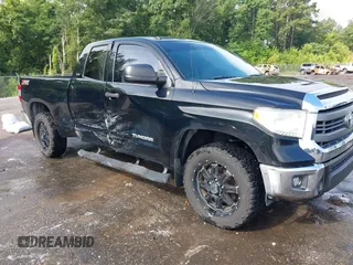 2015 Toyota Tundra SR with VIN 5TFRM5F14FX084901, listed as a IAAI auction lot 42515157 with 124,196 mi miles and . Bid and sale history available at DreamBid. Image 1.