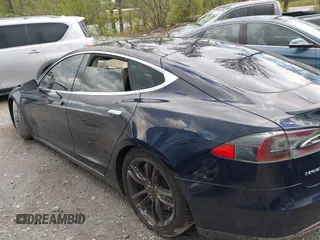 2014 Tesla Model S 60 with VIN 5YJSA1H15EFP43884, listed as a IAAI auction lot 41993180 with 78,305 mi miles and . Bid and sale history available at DreamBid. Image 13.
